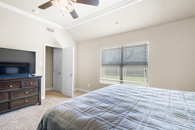 carpeted bedroom featuring lofted ceiling, ceiling fan, and crown molding