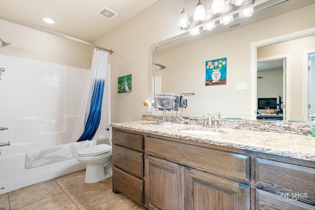 full bathroom featuring tile patterned flooring, vanity, toilet, and shower / bath combo with shower curtain