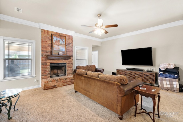 living room featuring crown molding, light carpet, ceiling fan, and a brick fireplace