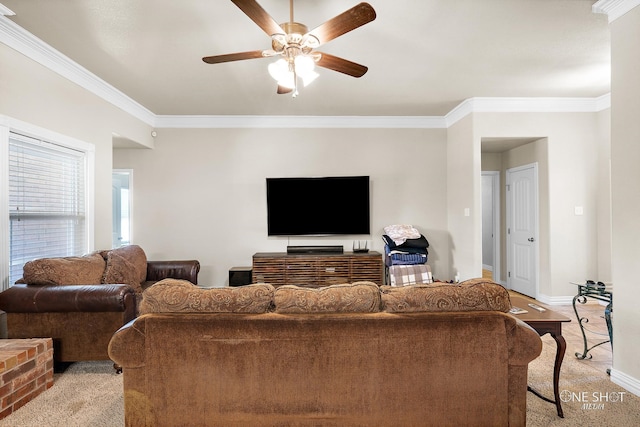 carpeted living room with crown molding and ceiling fan