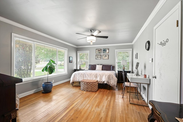 bedroom with ceiling fan, light hardwood / wood-style flooring, and crown molding