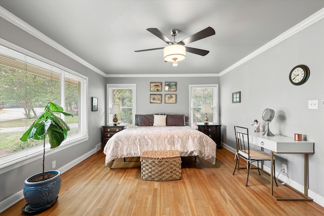 bedroom with ceiling fan, light hardwood / wood-style flooring, and crown molding