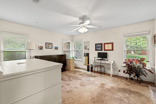 office space featuring light hardwood / wood-style floors and ceiling fan