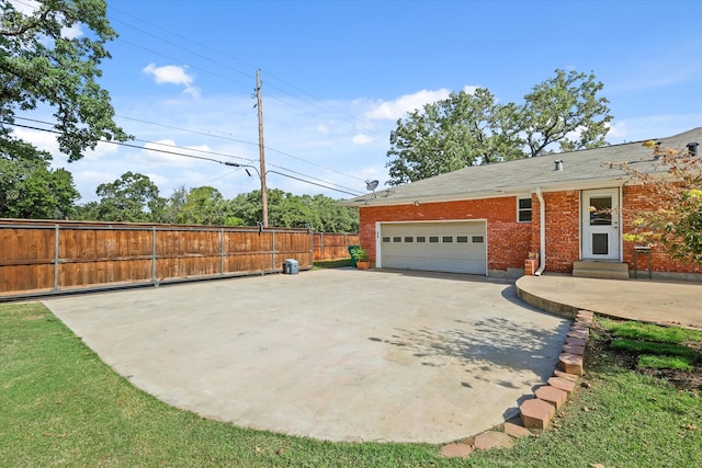 exterior space featuring a front lawn and a garage