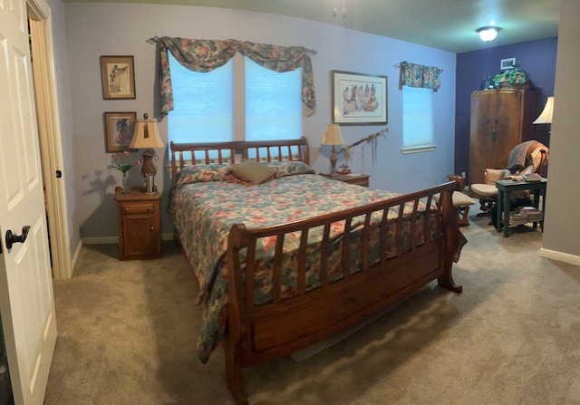 bedroom with light colored carpet