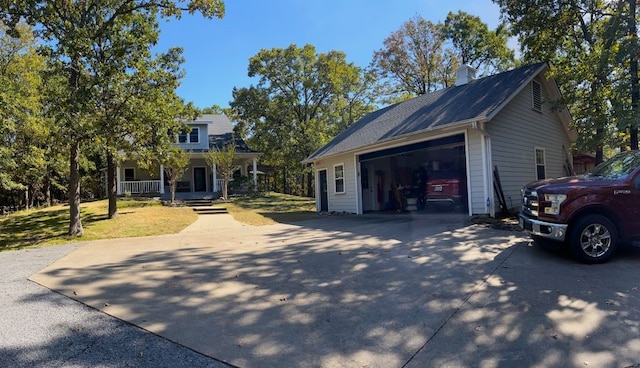 exterior space featuring a garage and covered porch