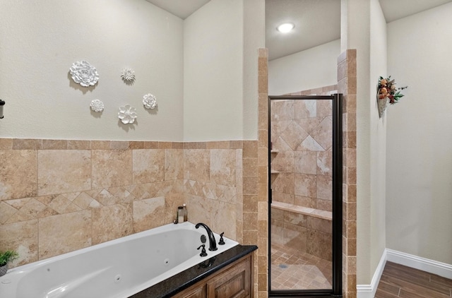 bathroom featuring wood-type flooring and plus walk in shower