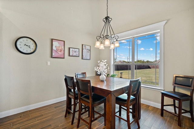 dining room featuring a chandelier and dark hardwood / wood-style flooring