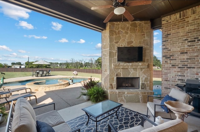 view of patio featuring an outdoor living space with a fireplace, a fenced in pool, and ceiling fan