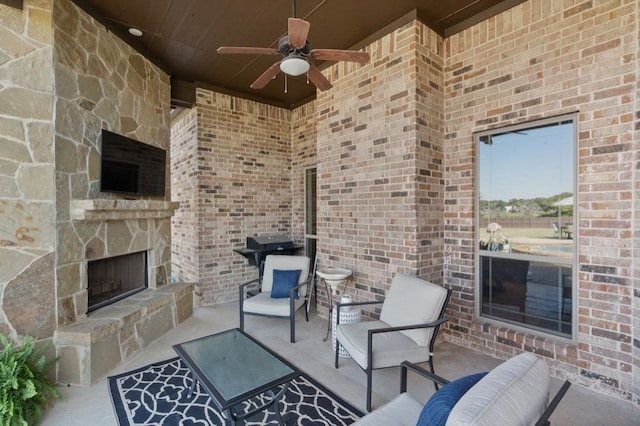 view of patio / terrace featuring an outdoor living space with a fireplace, a grill, and ceiling fan