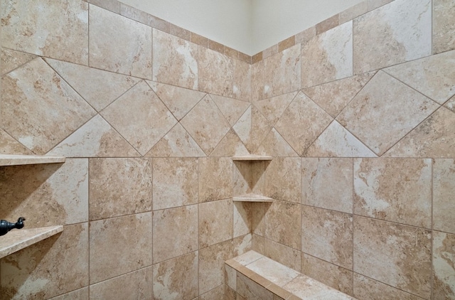 details with a tile shower