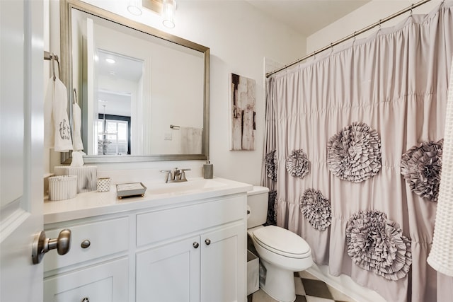 full bathroom with vanity, toilet, and shower / bath combo with shower curtain