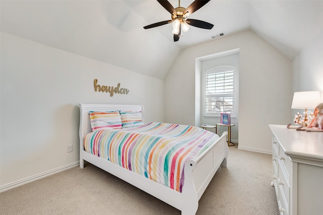 bedroom featuring ceiling fan, light colored carpet, and vaulted ceiling