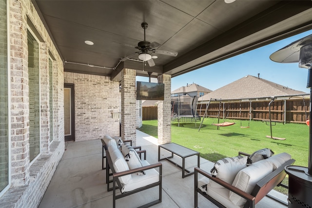 view of patio / terrace featuring outdoor lounge area, ceiling fan, and a trampoline