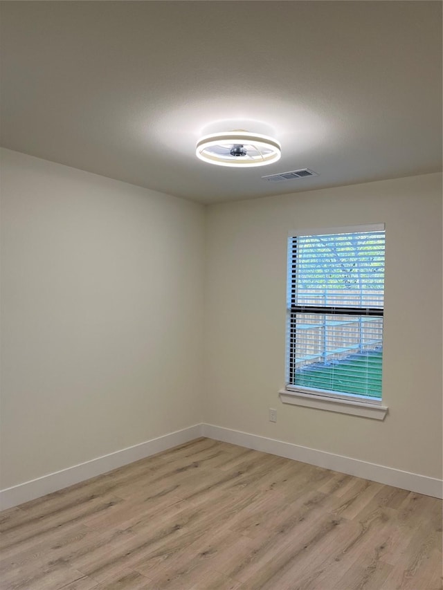 unfurnished room featuring light wood-type flooring