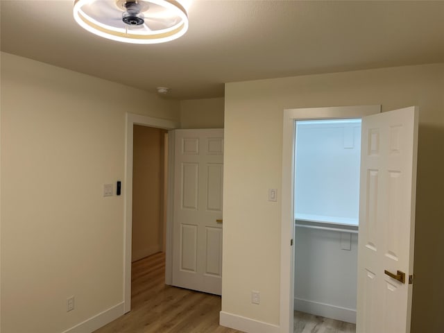 unfurnished bedroom with light wood-type flooring