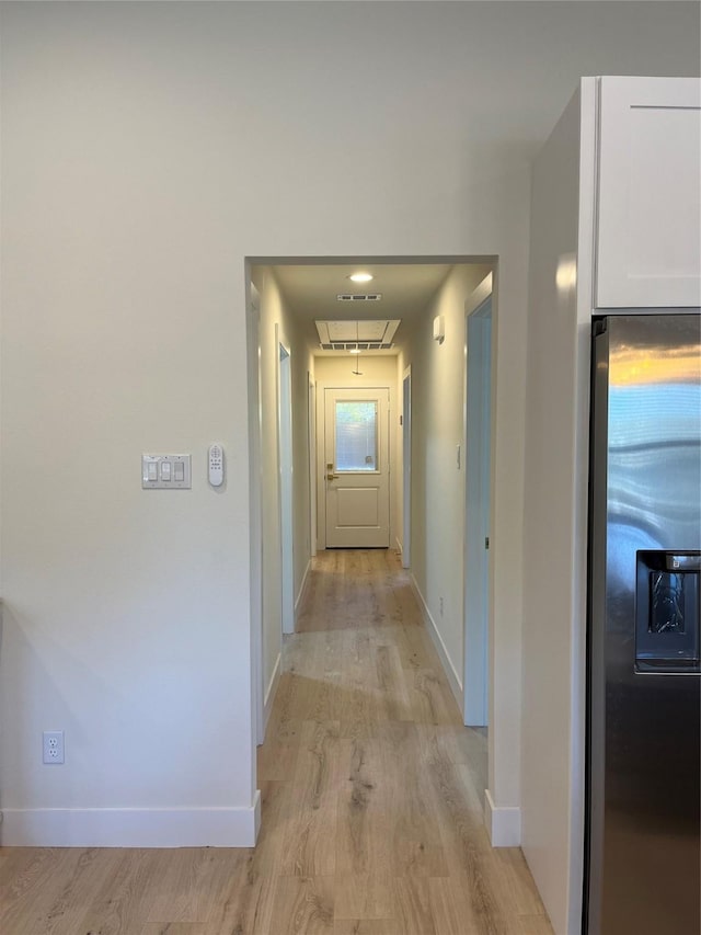 hallway with light wood-type flooring