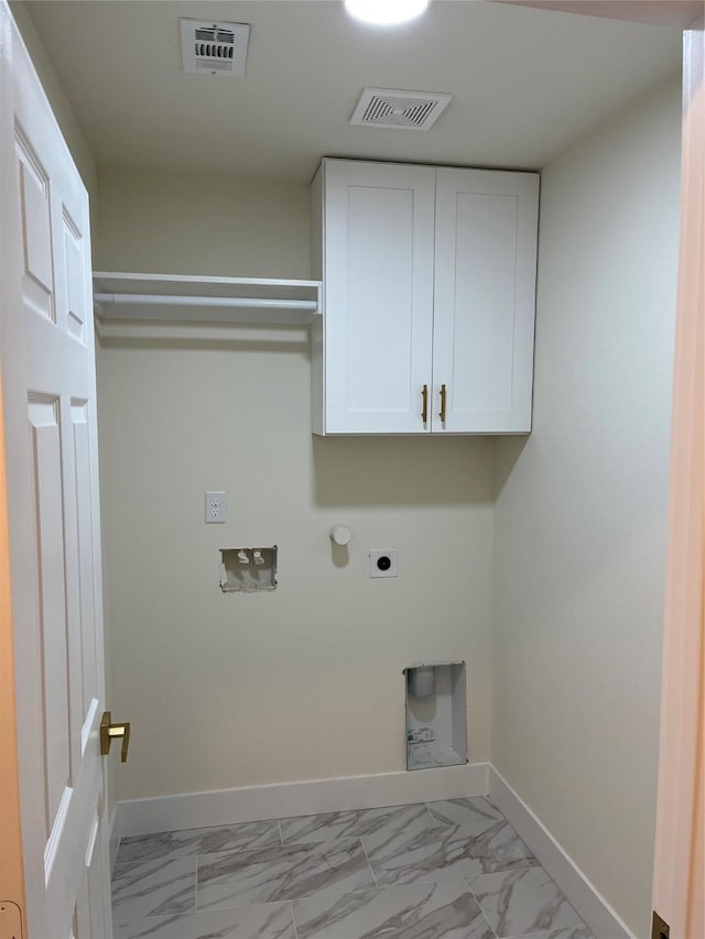 washroom featuring cabinets, electric dryer hookup, and washer hookup