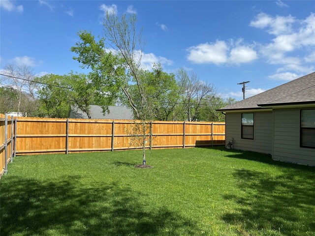 view of front of house featuring a garage and a front lawn