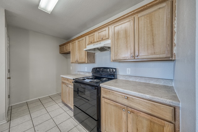 kitchen with light brown cabinets, black electric range, light tile patterned floors, and a textured ceiling