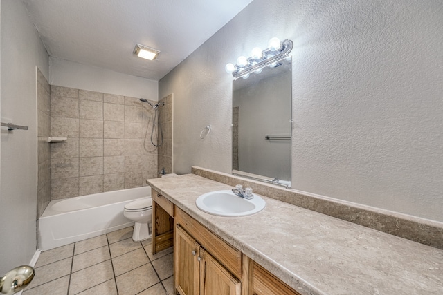 full bathroom featuring tile patterned flooring, vanity, toilet, and tiled shower / bath