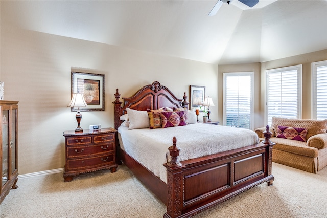 bedroom with vaulted ceiling, light carpet, and ceiling fan