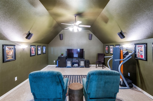 cinema with a textured ceiling, carpet flooring, and vaulted ceiling