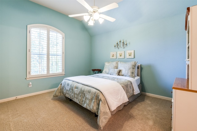 bedroom with lofted ceiling, light carpet, and ceiling fan