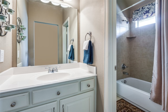 bathroom featuring vanity and shower / bath combo with shower curtain