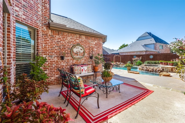 view of patio with a fenced in pool