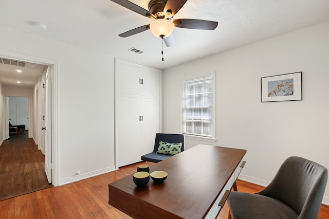 office space with ceiling fan and hardwood / wood-style flooring