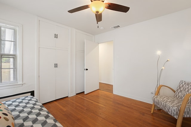 sitting room featuring hardwood / wood-style flooring and ceiling fan