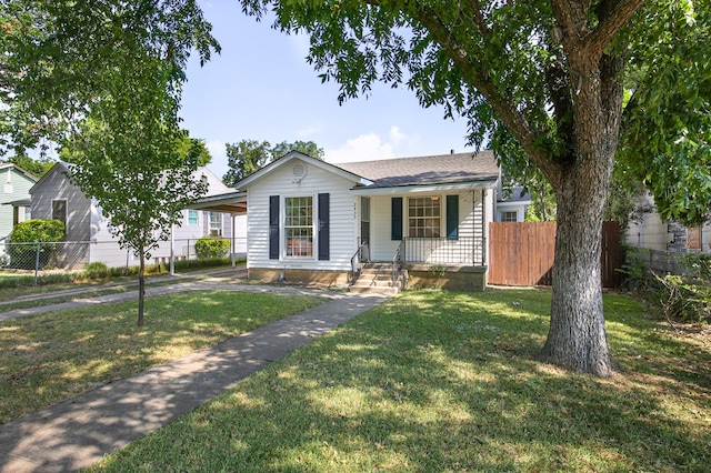 ranch-style house with a front lawn