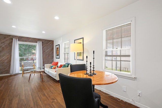 home office with a wealth of natural light and dark hardwood / wood-style floors