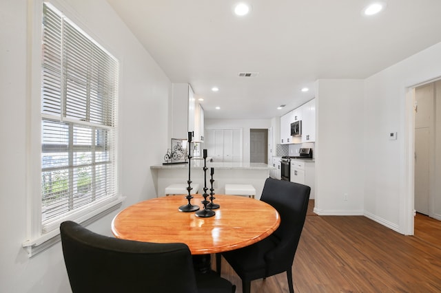 dining room featuring dark hardwood / wood-style floors