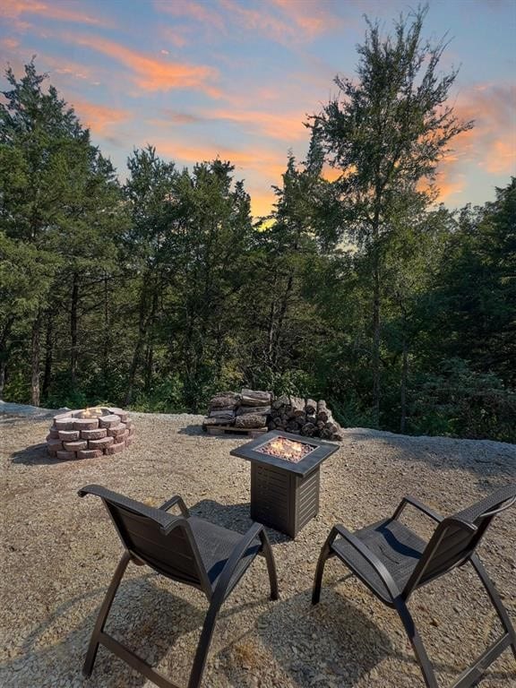 patio terrace at dusk with an outdoor fire pit