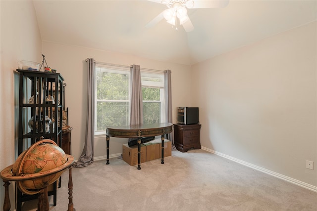 carpeted office space with lofted ceiling and ceiling fan