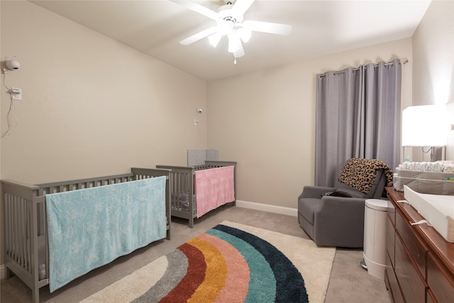 carpeted bedroom featuring ceiling fan