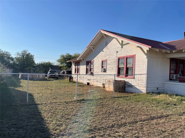 view of property exterior with a lawn