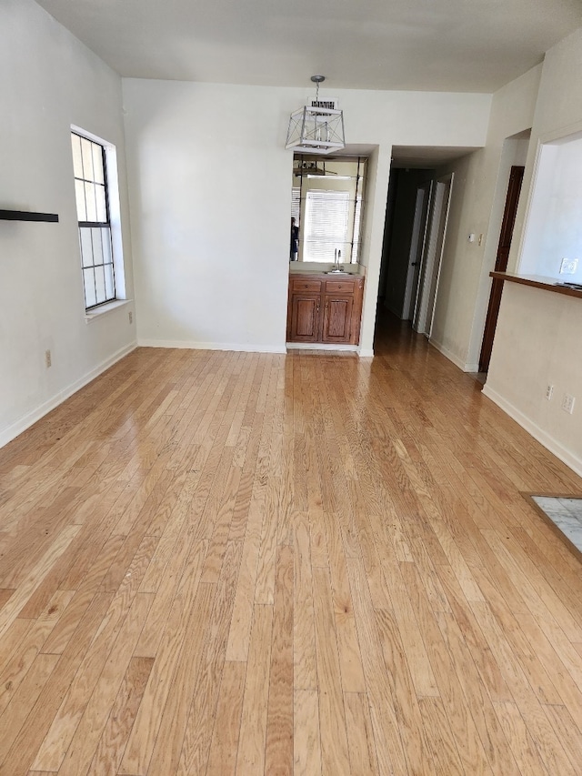 unfurnished room with light hardwood / wood-style floors