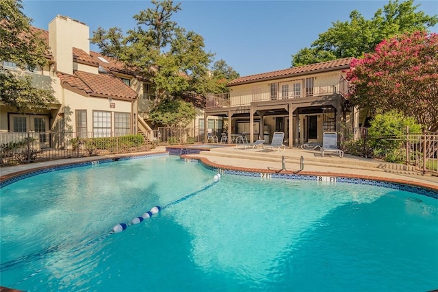 view of swimming pool featuring a patio area