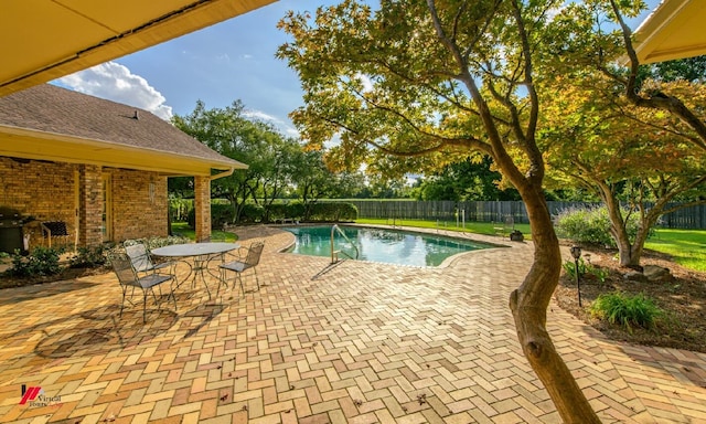 view of pool featuring a patio area