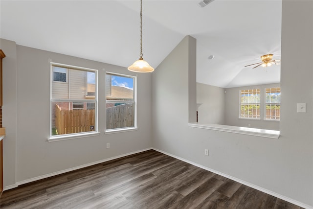 unfurnished dining area featuring ceiling fan, lofted ceiling, and dark hardwood / wood-style flooring