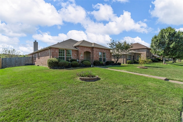 ranch-style home featuring a front lawn