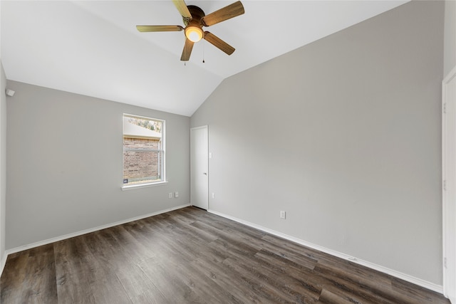 unfurnished room with lofted ceiling, ceiling fan, and dark wood-type flooring