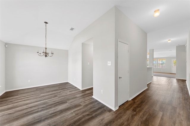 interior space featuring lofted ceiling, a chandelier, and dark wood-type flooring