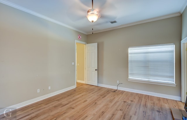 unfurnished room with ceiling fan, light hardwood / wood-style floors, and ornamental molding