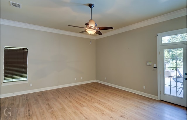 empty room with light hardwood / wood-style flooring, ceiling fan, and ornamental molding