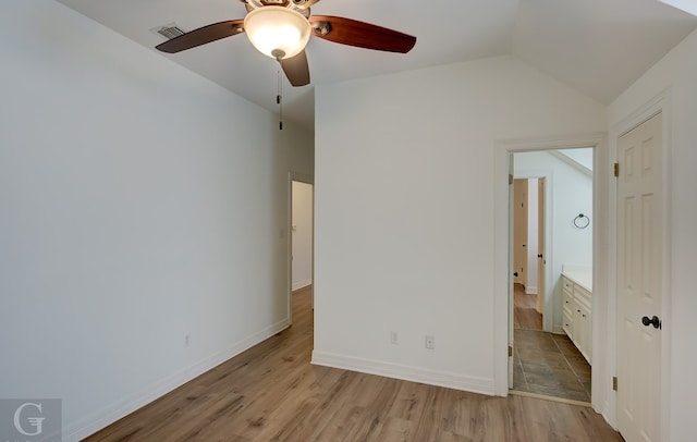 unfurnished bedroom featuring ceiling fan, vaulted ceiling, and light hardwood / wood-style floors