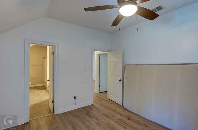 unfurnished bedroom with vaulted ceiling, ceiling fan, and light hardwood / wood-style flooring